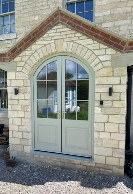 Curve top wooden french doors