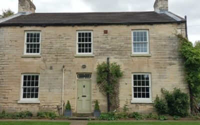 Restoring the Wooden Windows of a Detached Stone House in Saxton Village